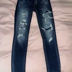 dark wash stretch ripped jeans